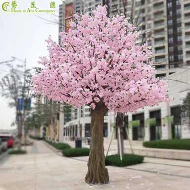 Keinotekoiset vaaleanpunaiset kirsikkapuun oksat